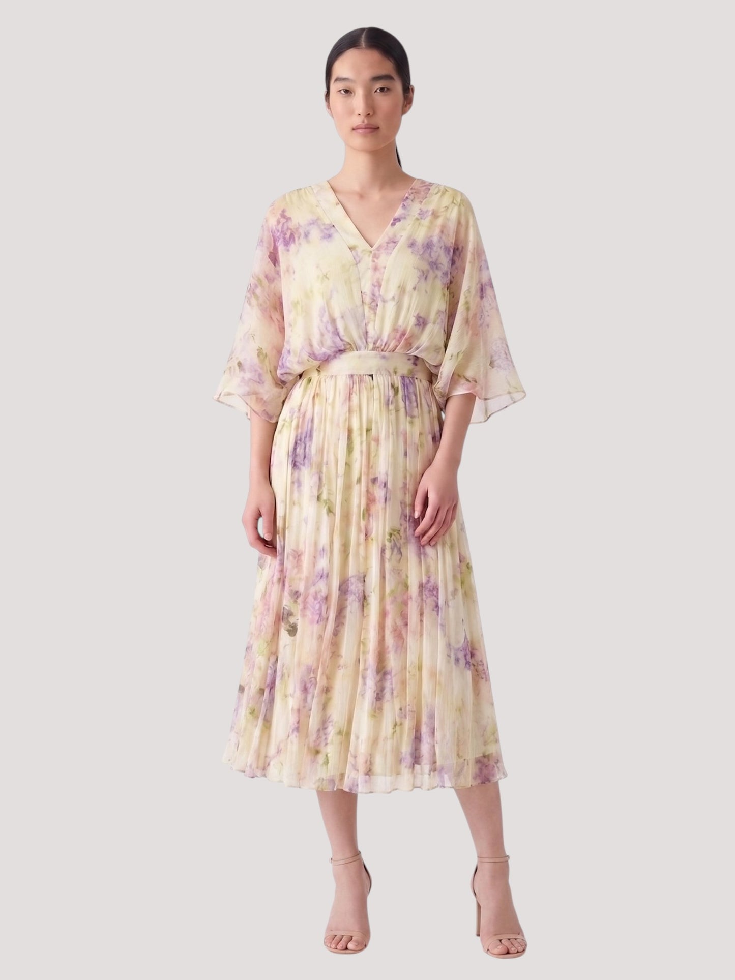 Catherine Martin floral silk midi dress with kimono sleeves, V-neckline, and pleated skirt in lilac and cream.