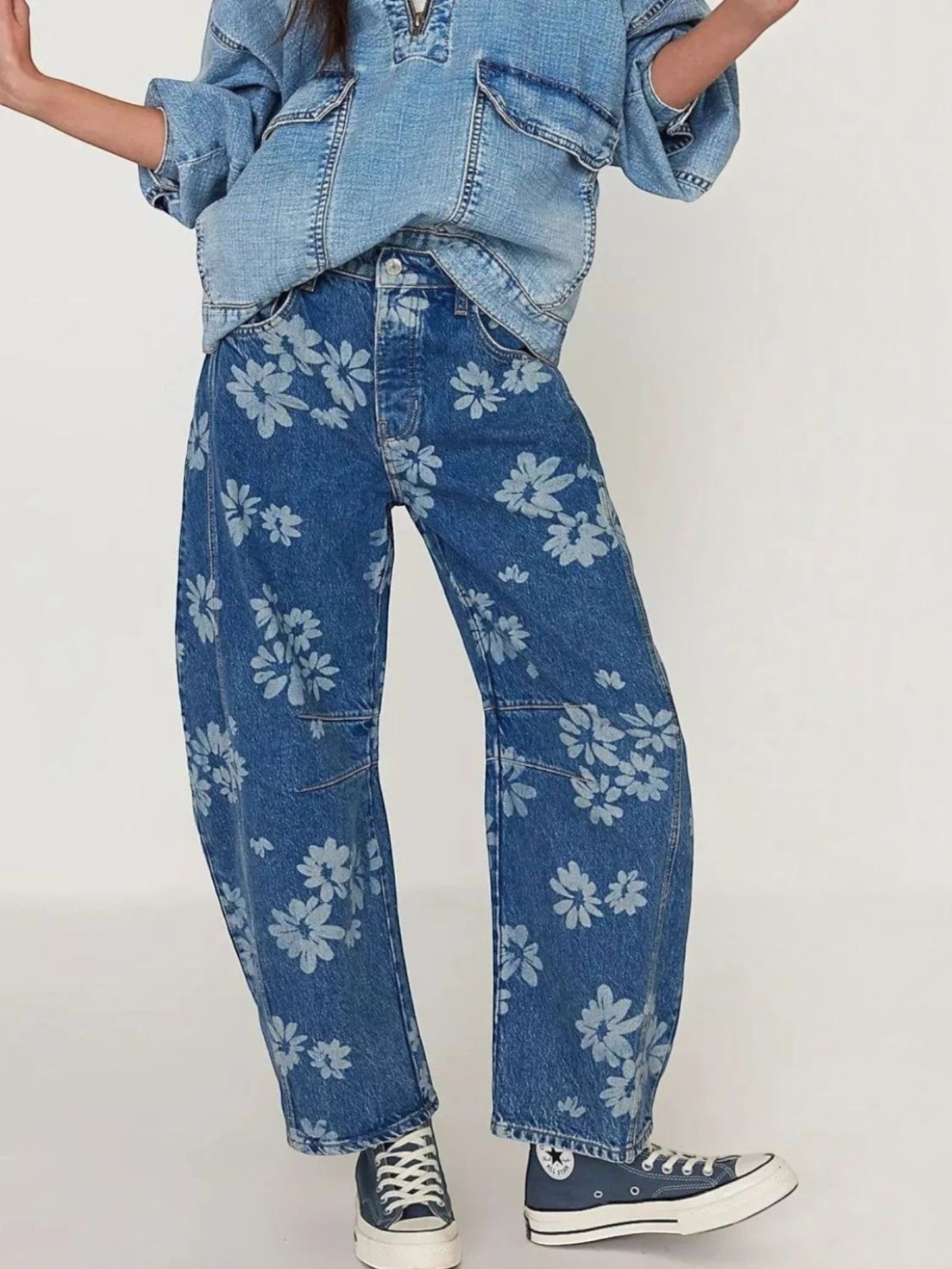 Catherine Martin wide-leg denim jeans featuring a blue floral print, relaxed fit, and front pockets.