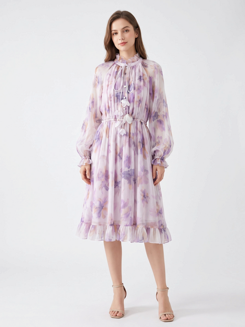 Catherine Martin lilac floral silk chiffon dress with ruffle collar, tie neck, and billowy sleeves on a model.