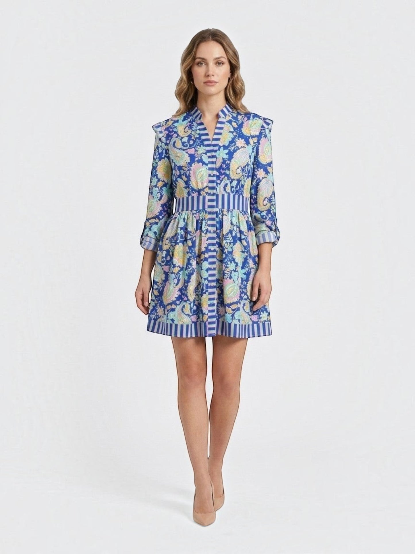 Catherine Martin paisley print mini dress in blue polyester with ruffled shoulders, button front, and striped trim.