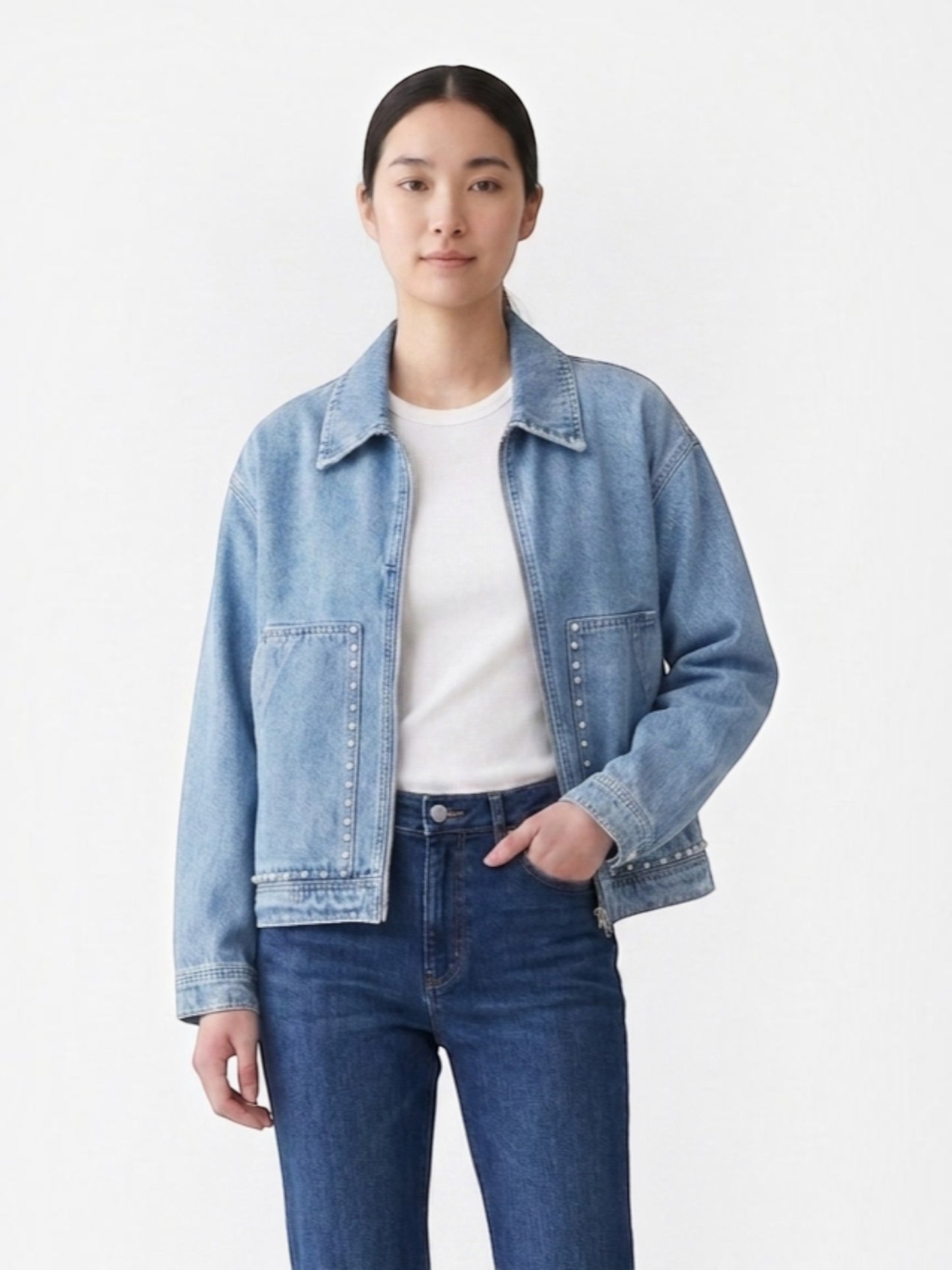 Catherine Martin light-wash denim jacket with pearl stud details, collared neckline, and front metal zipper