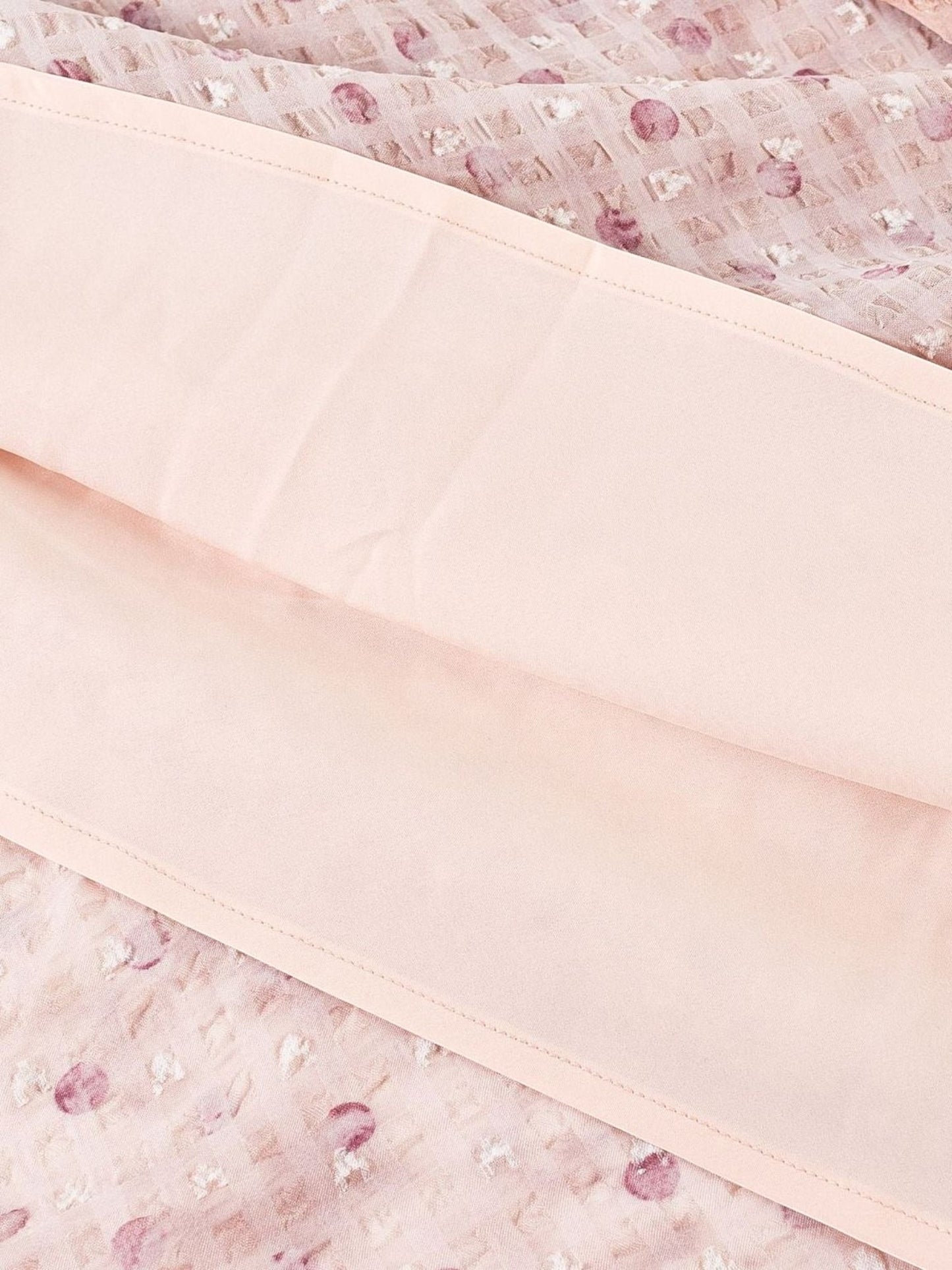 Catherine Martin dusty pink maxi dress fabric detail showing floral polka dot print and soft polyester lining