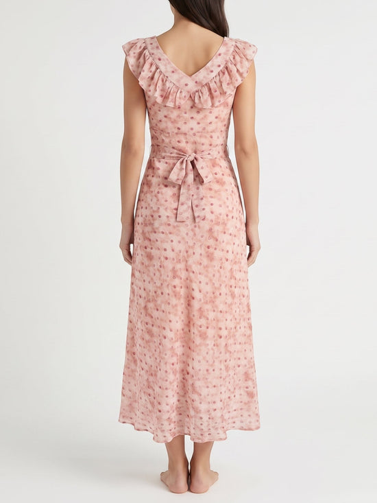 Back view of a Catherine Martin dusty pink maxi dress with floral polka dot print, ruffled neckline, and tie waist.