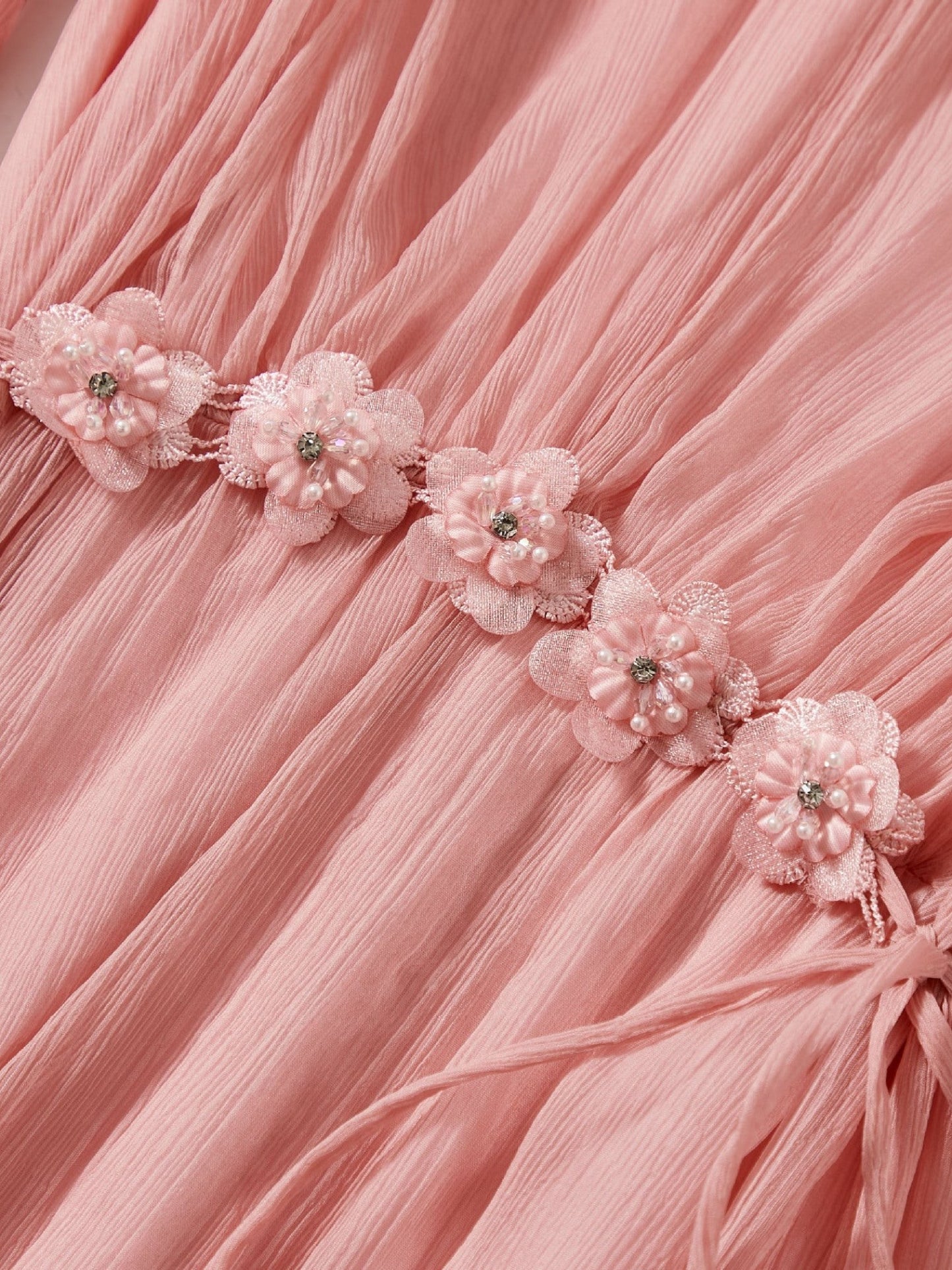 Catherine Martin pink silk midi dress featuring a delicate floral waist trim with beaded accents and tie cords.
