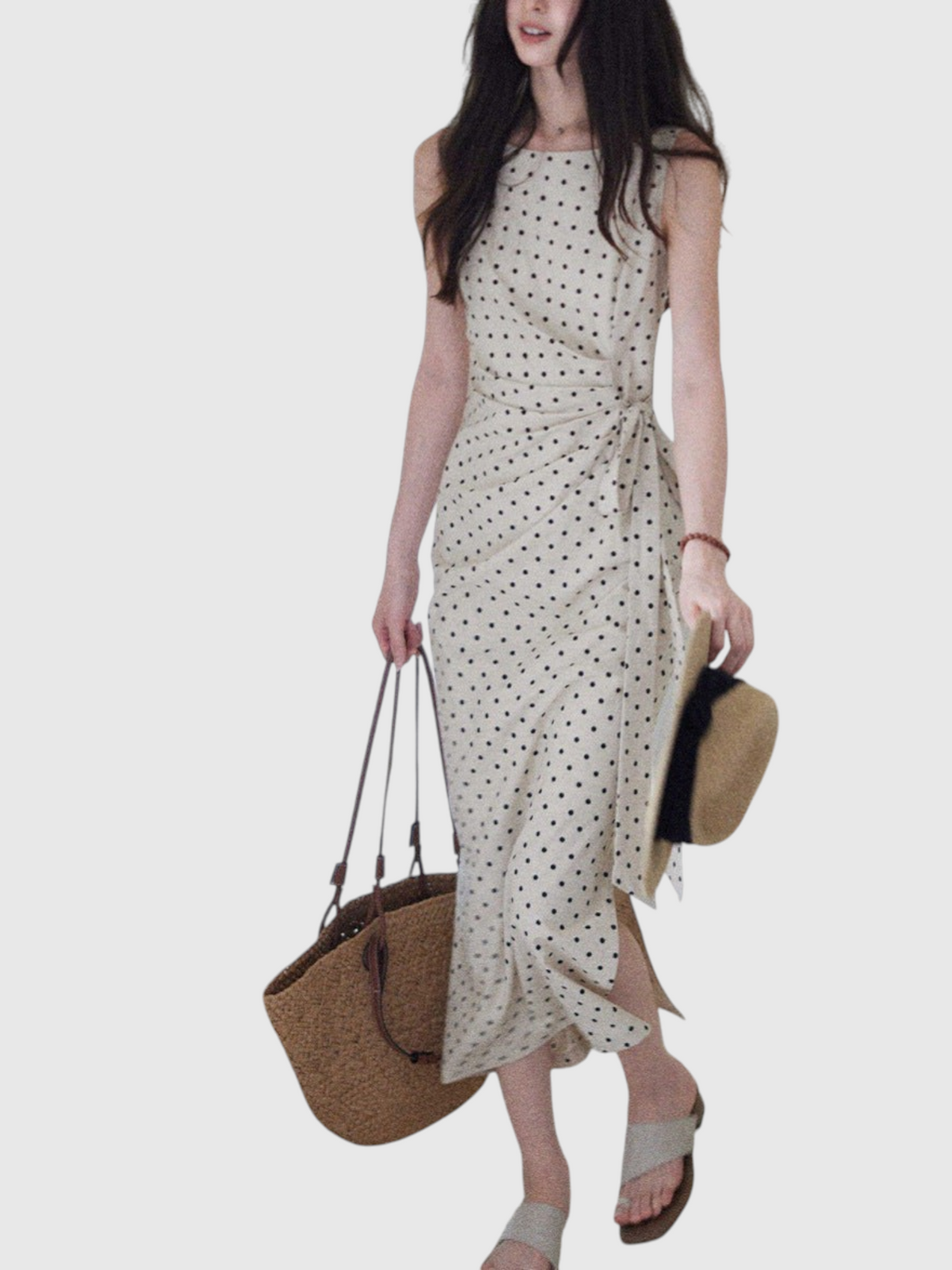 Catherine Martin beige linen-cotton midi dress with black polka dots, boat neckline, and side tie waist detail.
