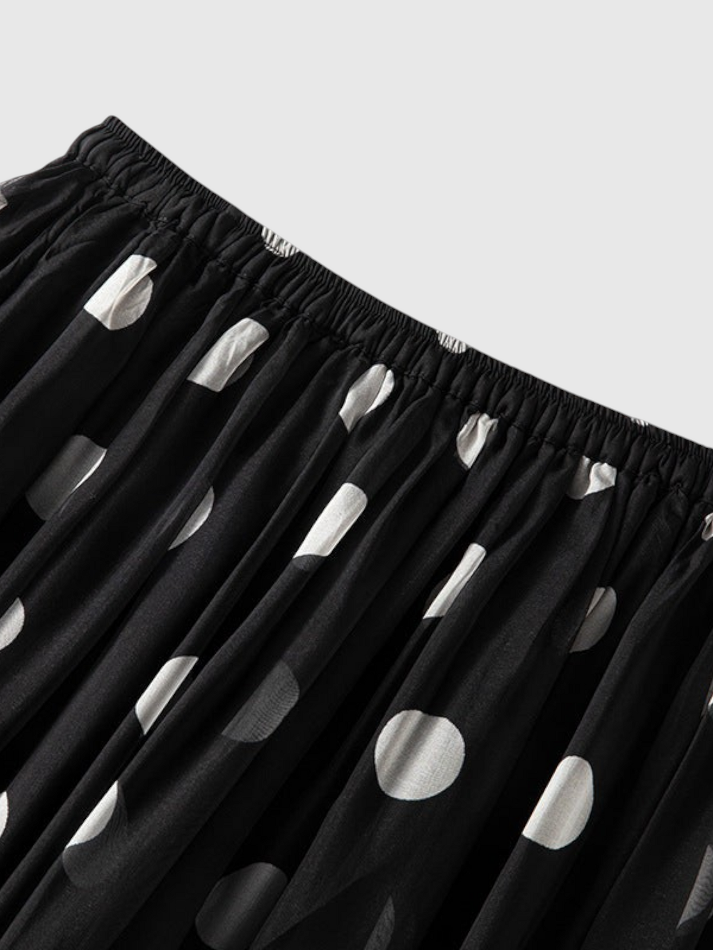 Catherine Martin black and white polka dot silk midi skirt with an elastic waistband and flowing A-line silhouette.