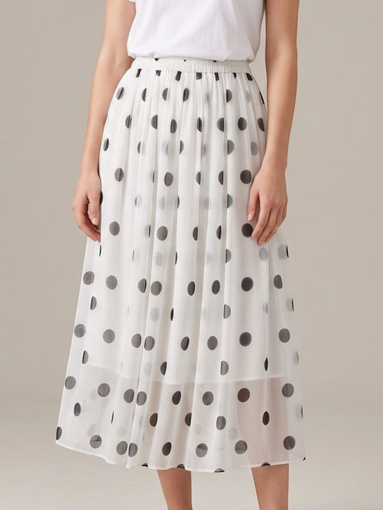 Catherine Martin white silk midi skirt with black polka dots, A-line silhouette, and elastic waistband.