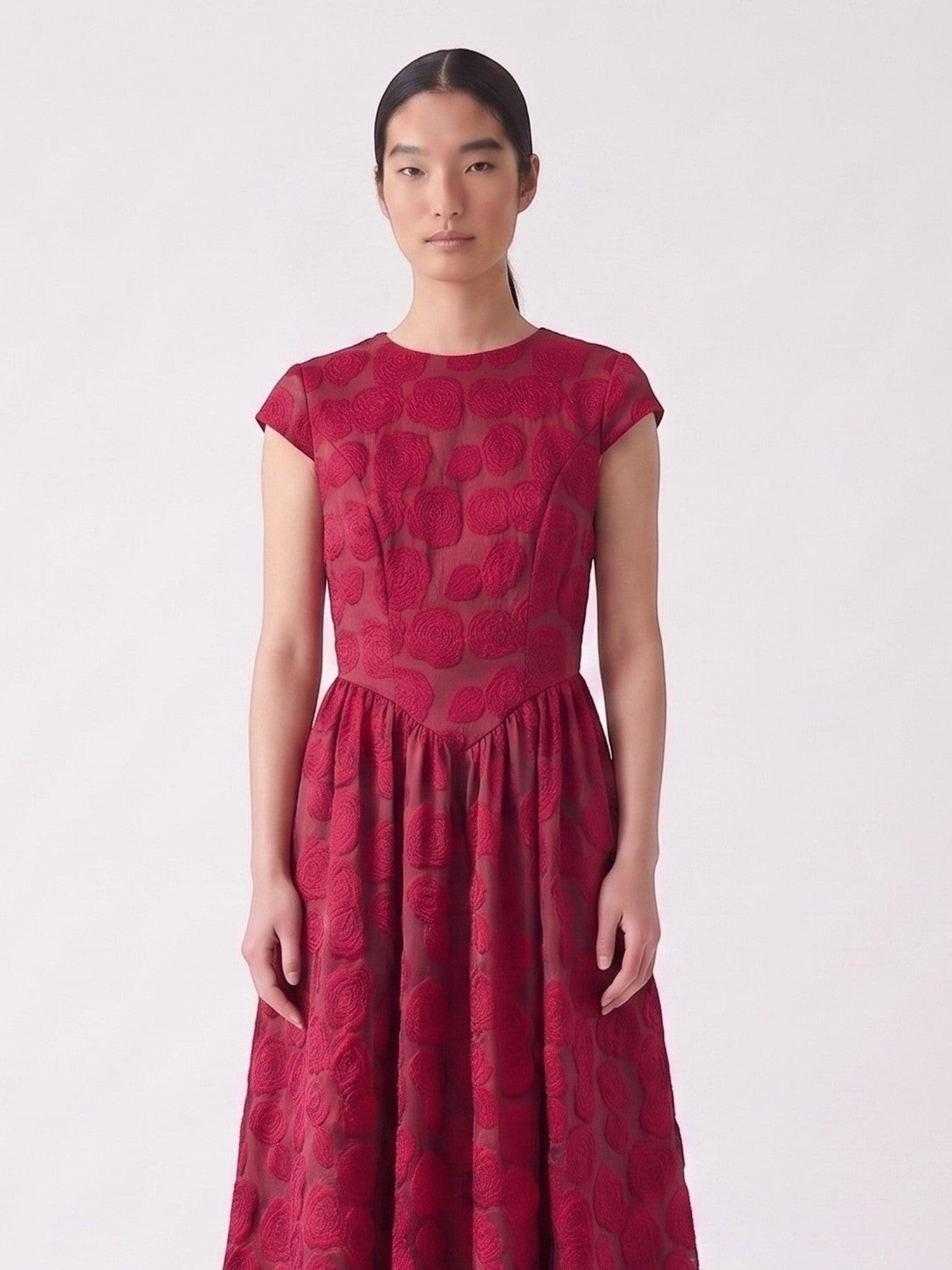 Catherine Martin red rose jacquard mid-length dress with short sleeves and a relaxed waist on a model