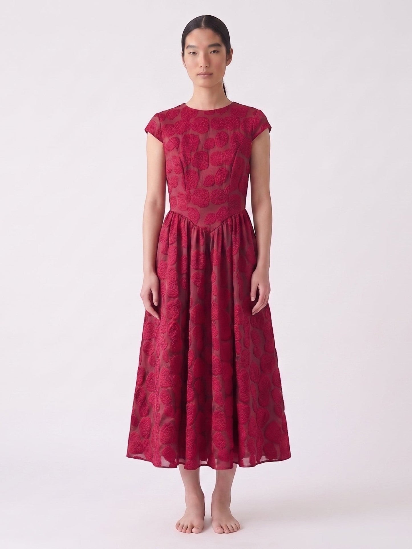 Catherine Martin red rose jacquard mid-length dress with short sleeves and a relaxed waist on a model