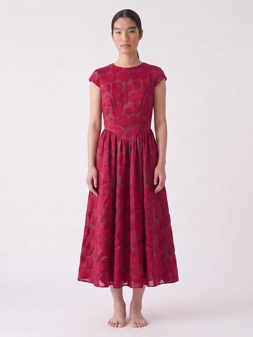 Catherine Martin red rose jacquard mid-length dress with short sleeves and a relaxed waist on a model