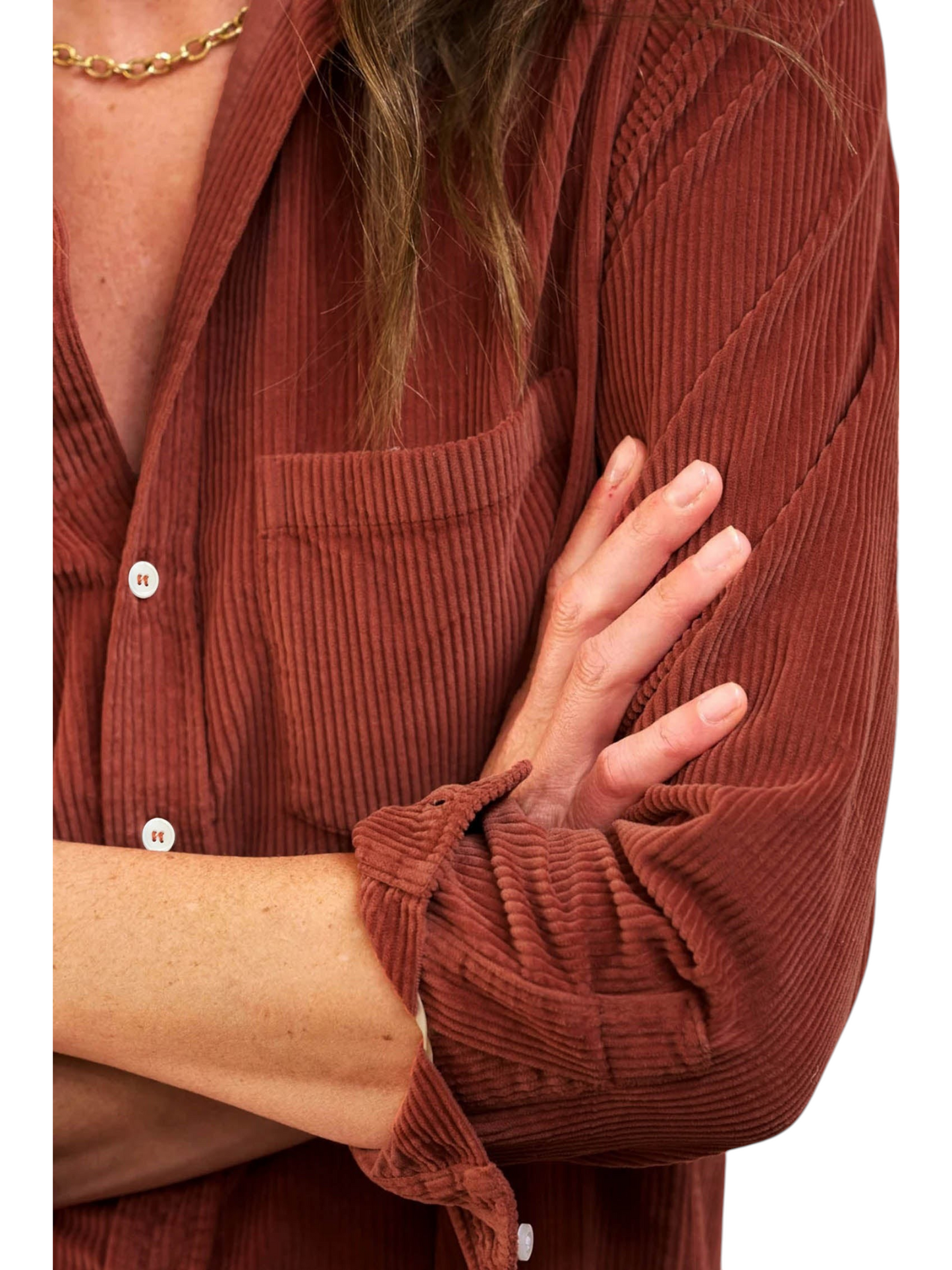 Catherine Martin rust-coloured corduroy shirt dress featuring a chest patch pocket, button placket, and rolled sleeves.