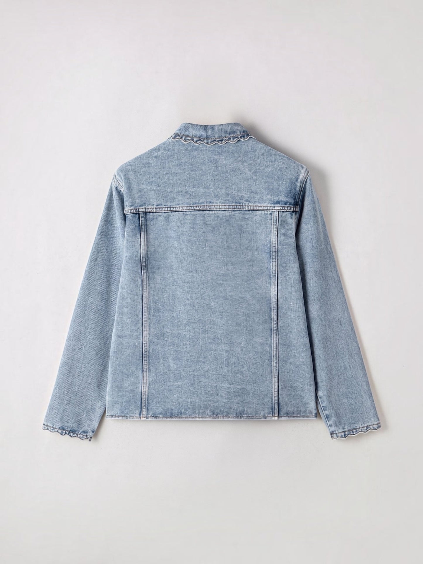 Catherine Martin light-wash denim jacket featuring a collared neckline and delicate scalloped trim on the cuffs