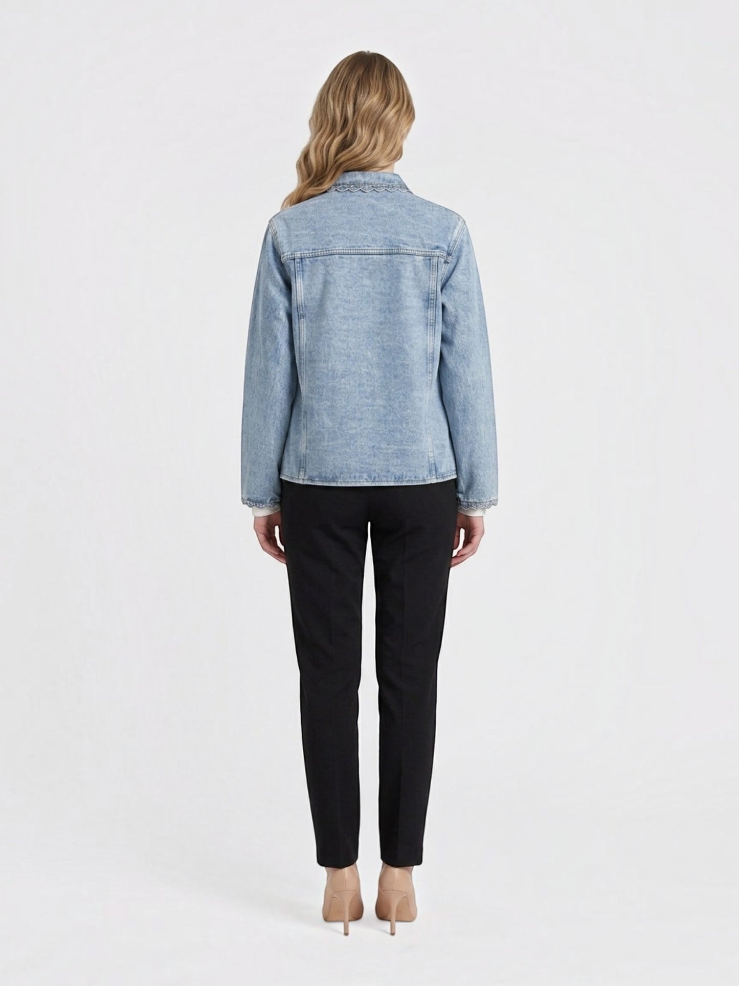 Catherine Martin light-wash denim jacket with scalloped trim on collar and cuffs, back view on a model.