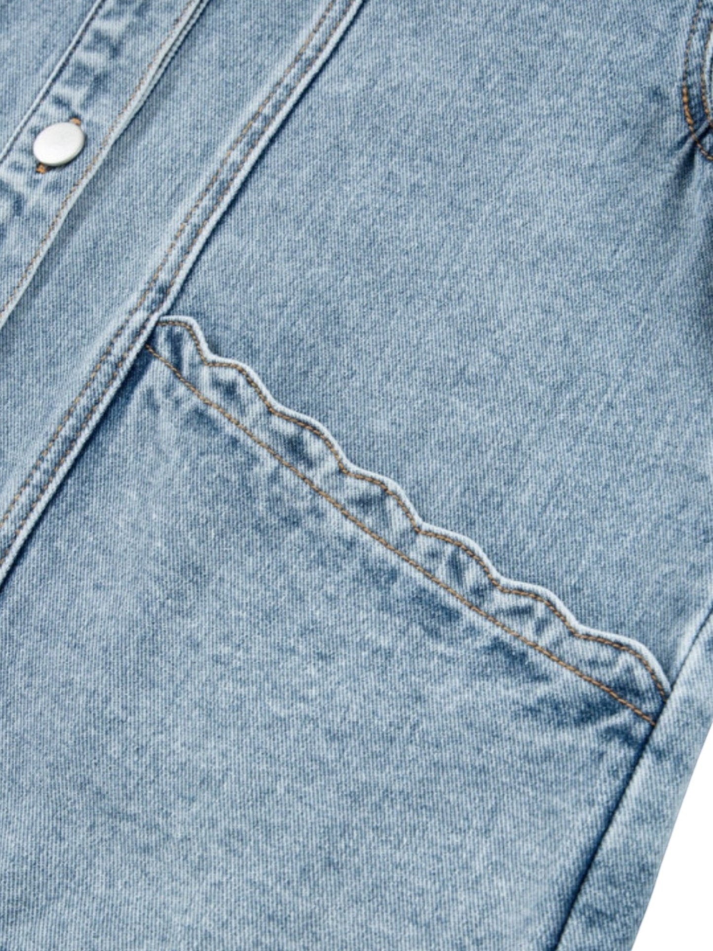Catherine Martin light wash denim jacket featuring a detailed scalloped trim on the front pocket and snap button