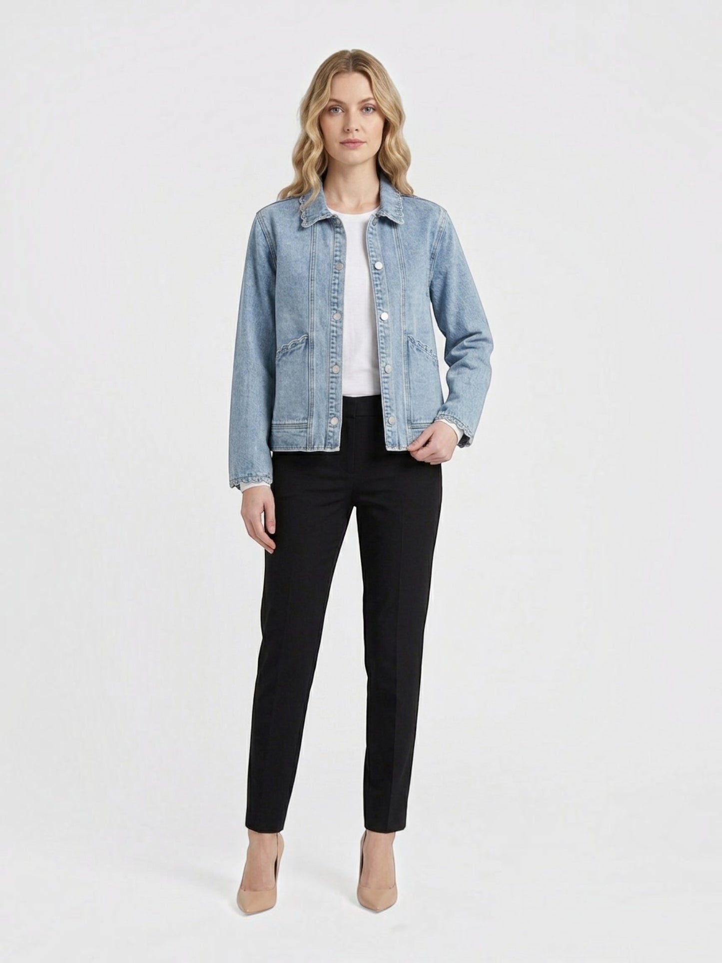 Catherine Martin light-wash denim jacket with scalloped trim, collared neckline, and pearl-style snap button closure.