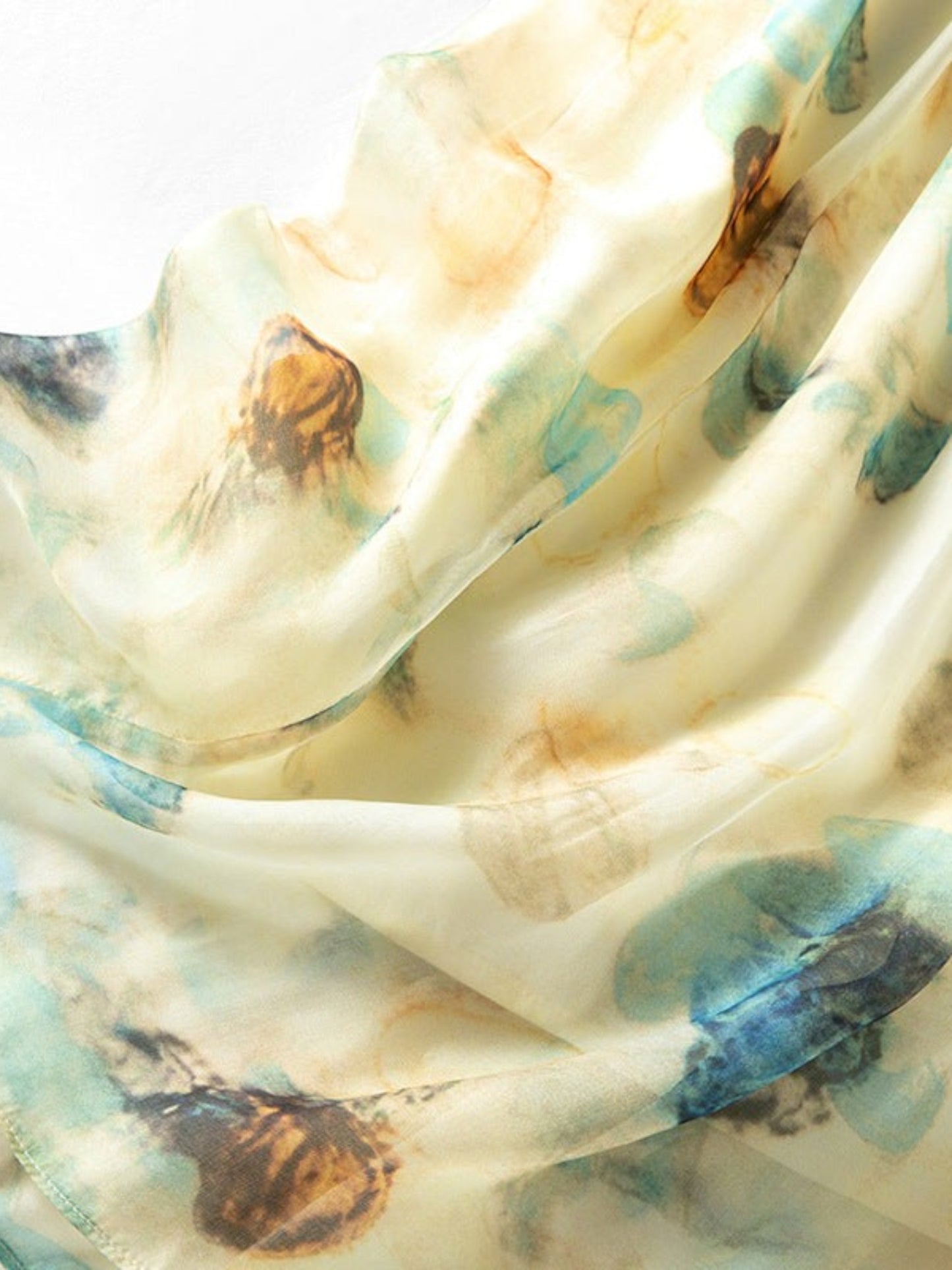 Catherine Martin silk chiffon midi skirt featuring a soft blue and gold watercolour print on a pale yellow background