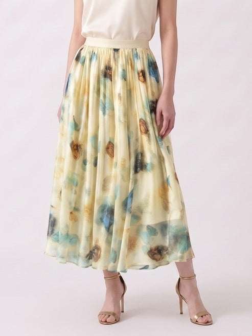 Catherine Martin pleated midi skirt in silk chiffon with a blue and gold watercolour print on a pale yellow base.
