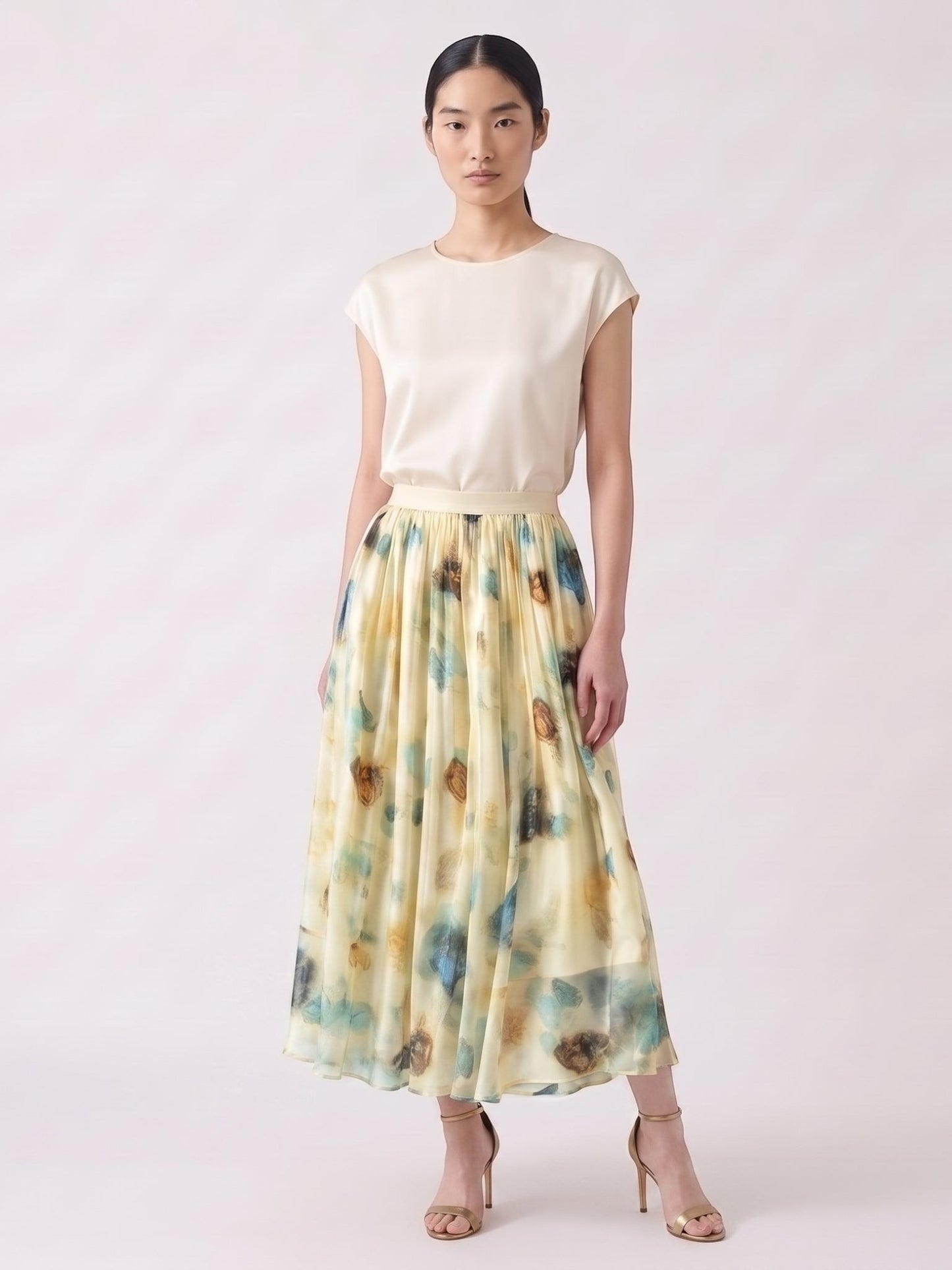 Catherine Martin silk chiffon midi skirt with a blue and gold watercolour print and elegant pleated A-line silhouette.