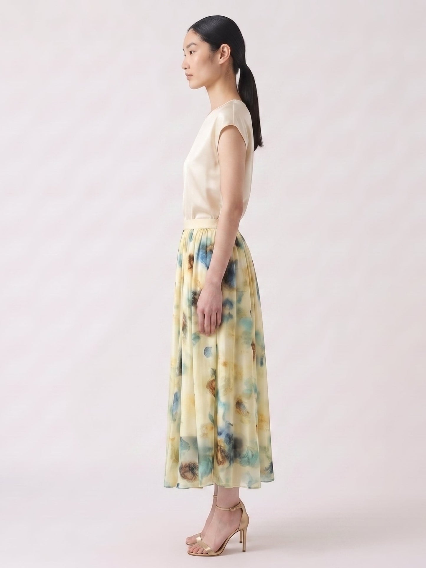 Catherine Martin silk chiffon midi skirt with a blue and gold watercolour print and pleated A-line silhouette.