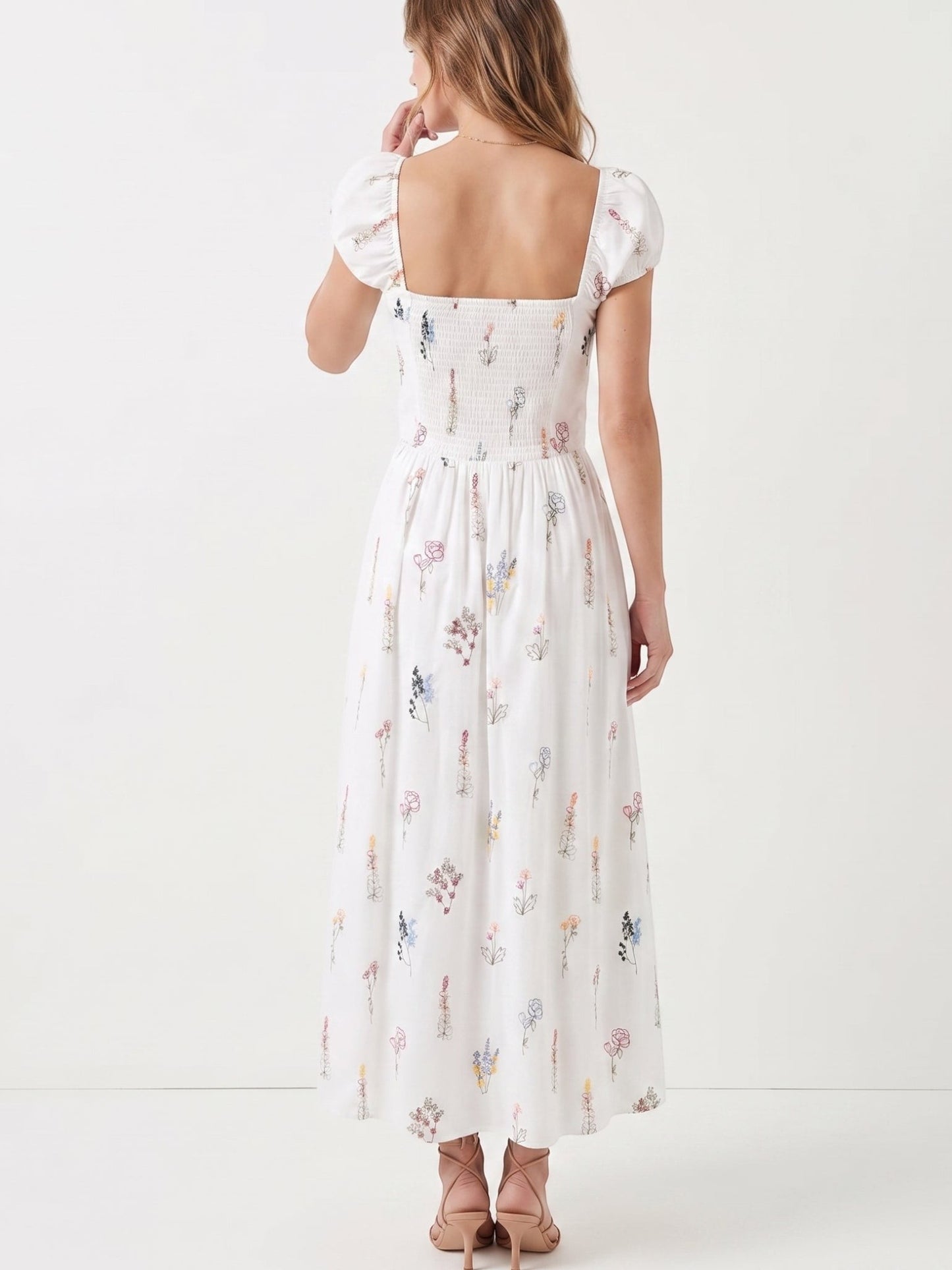 Catherine Martin white cotton midi dress with wildflower print, square neckline, puff sleeves, and smocked back view