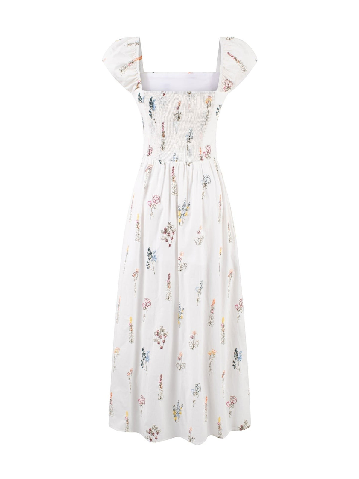 Catherine Martin white cotton midi dress with wildflower print, square neckline, puff sleeves, and smocked bodice.