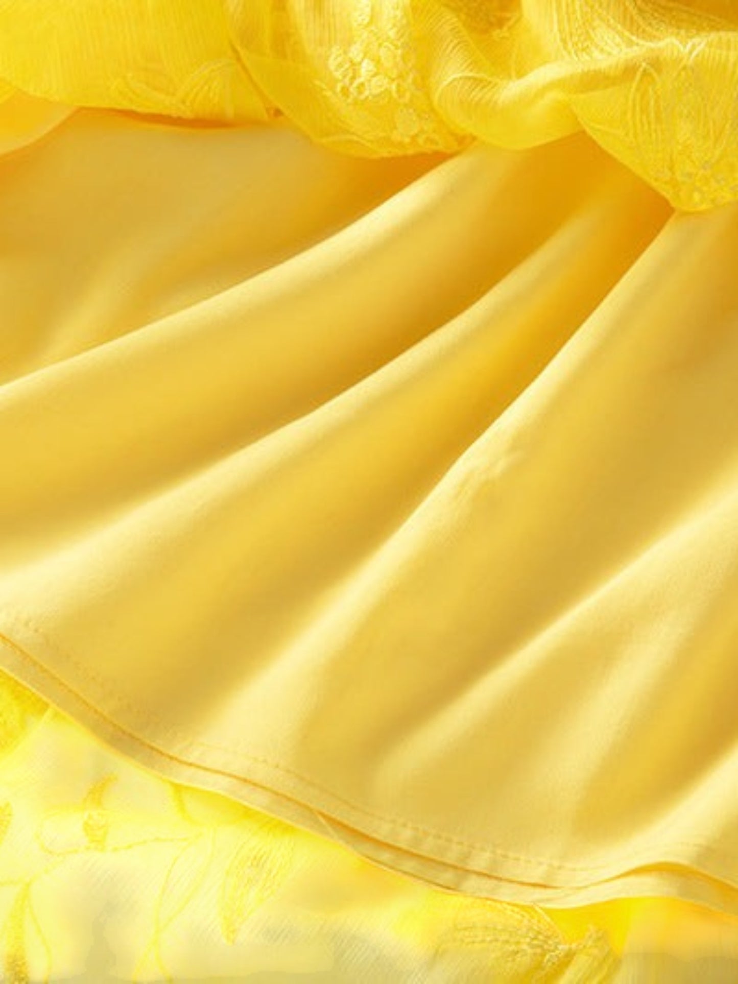 Close-up of Catherine Martin yellow silk chiffon midi skirt with delicate floral and butterfly embroidery