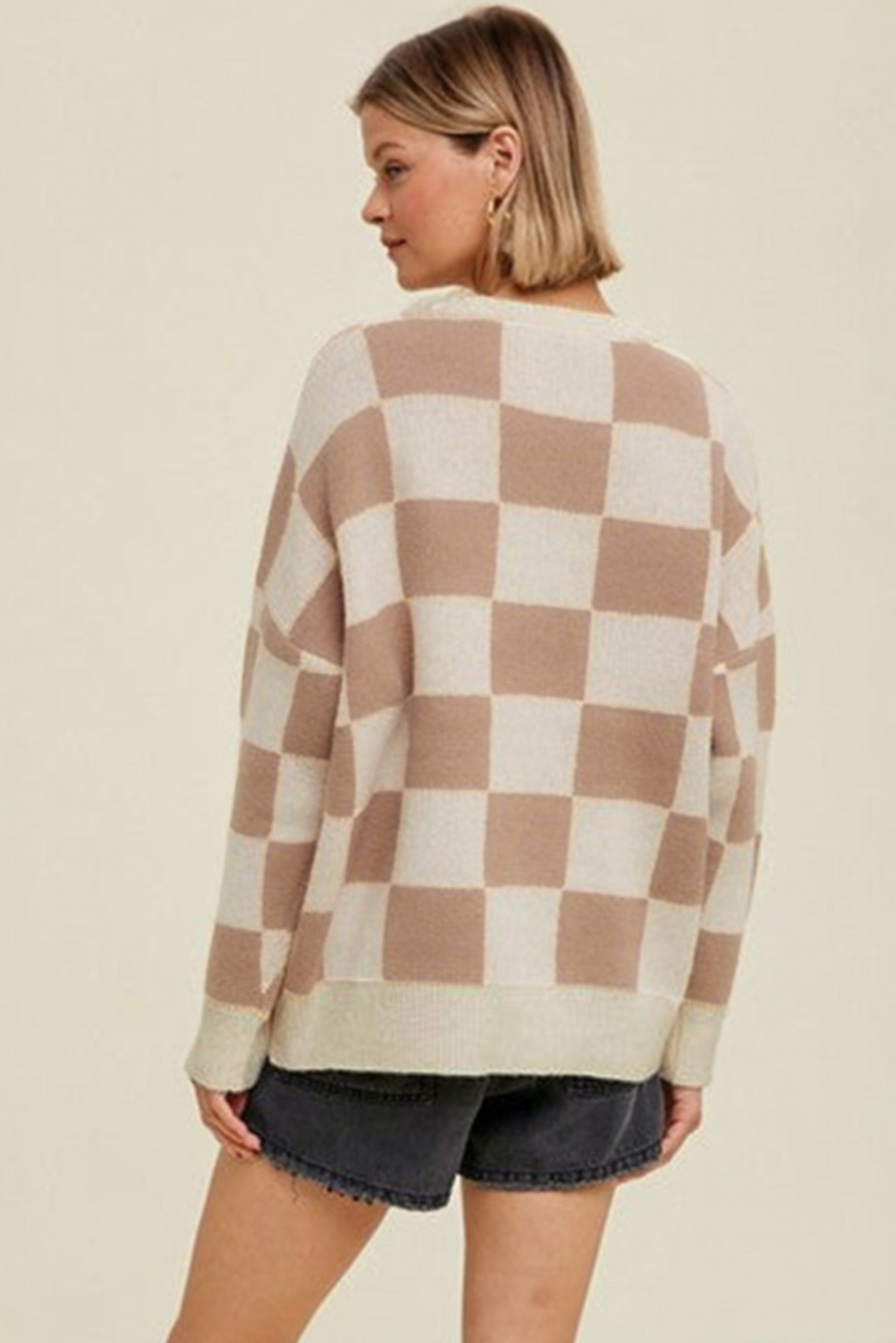 Mocha checkerboard crew neck knit sweater back view styled with black denim shorts