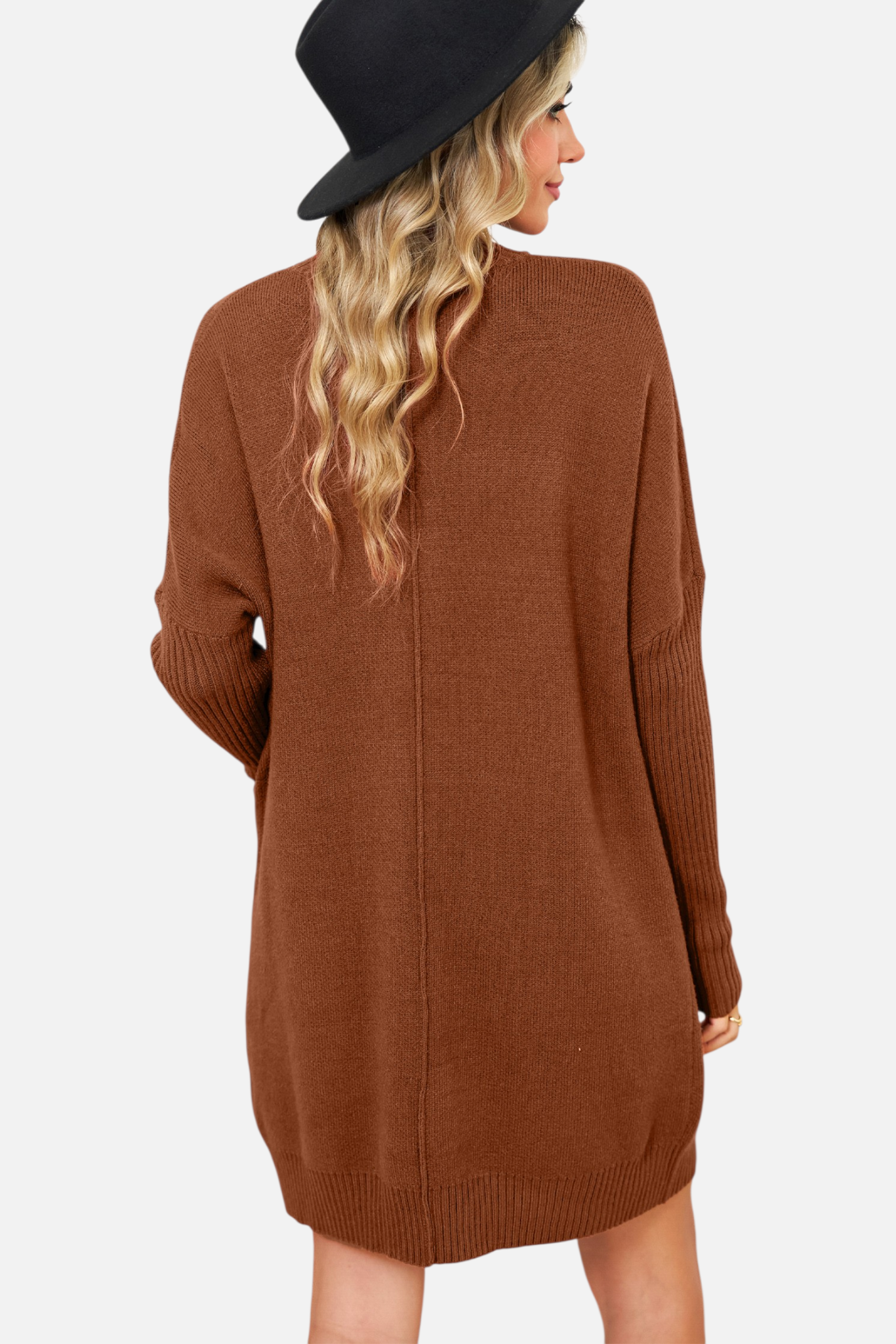 Back view of a model wearing a chestnut brown high-neck knit mini dress with functional front pockets and a vertical centre seam detail.