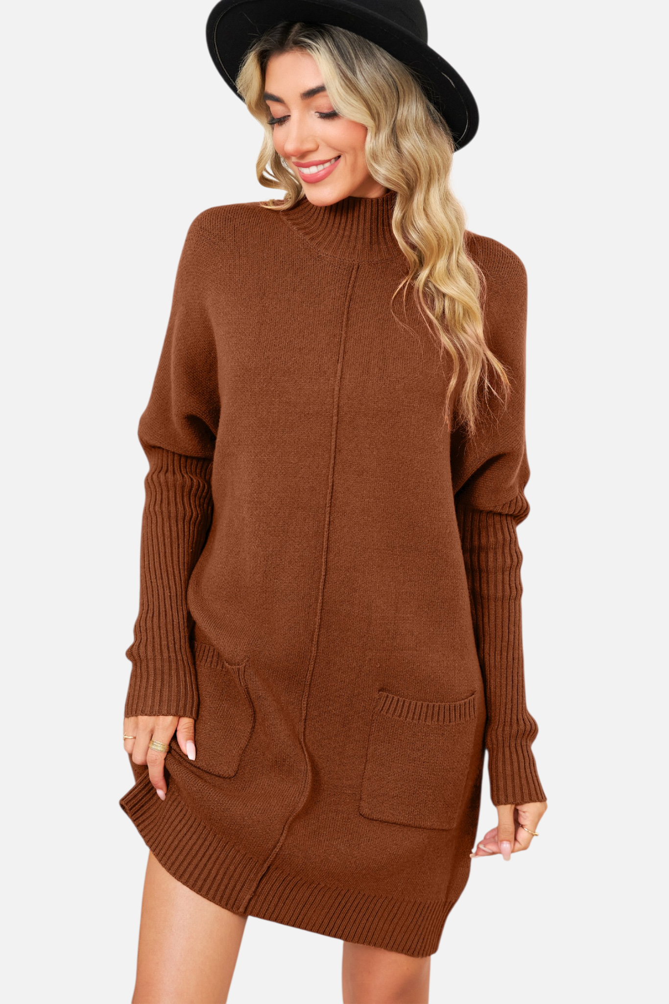 Front view of a model wearing a chestnut brown high-neck knit mini dress with functional front pockets and a vertical centre seam detail.