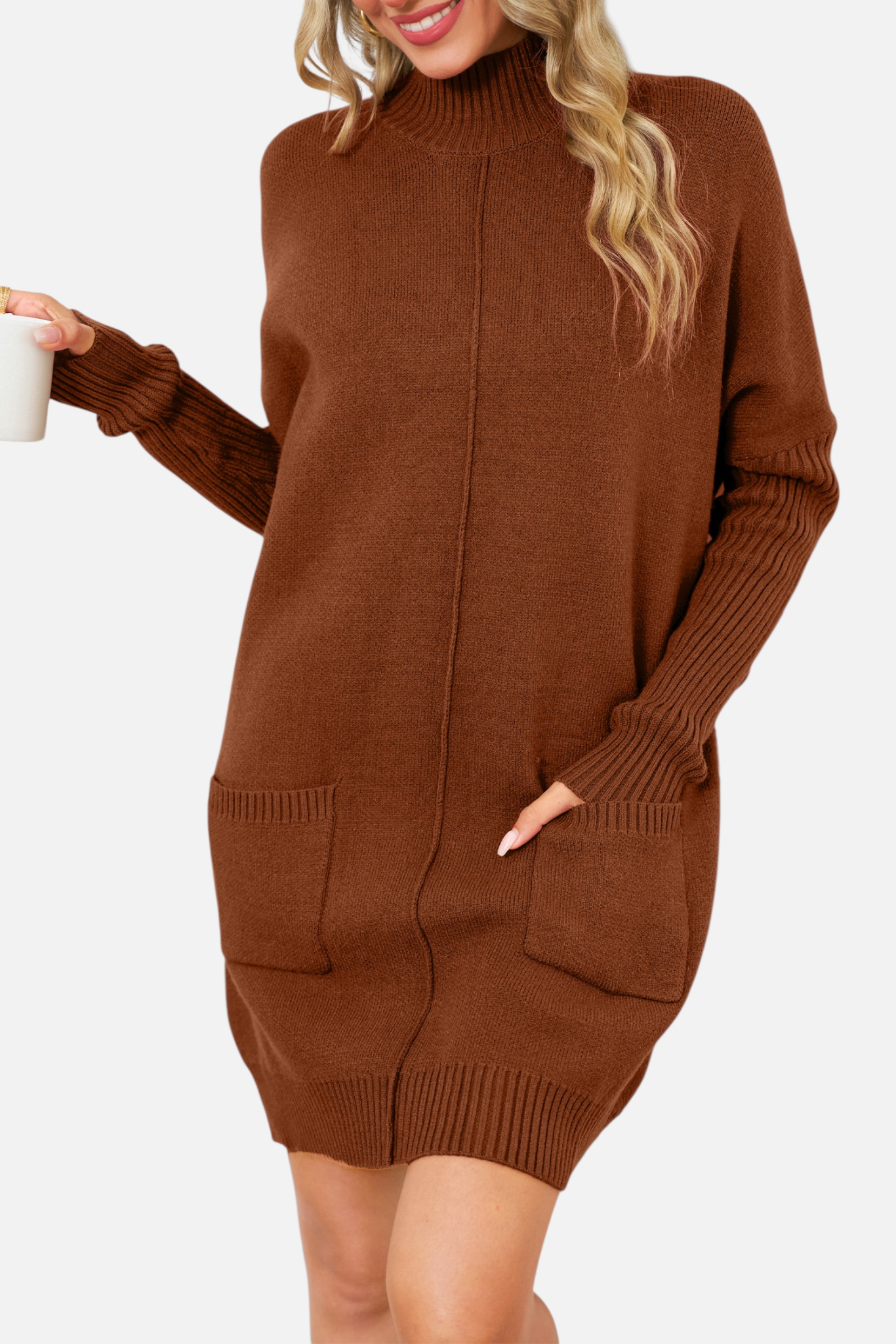 Front view of a model wearing a chestnut brown high-neck knit mini dress with functional front pockets and a vertical centre seam detail.