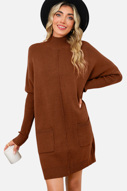 Front view of a model wearing a chestnut brown high-neck knit mini dress with functional front pockets and a vertical centre seam detail.