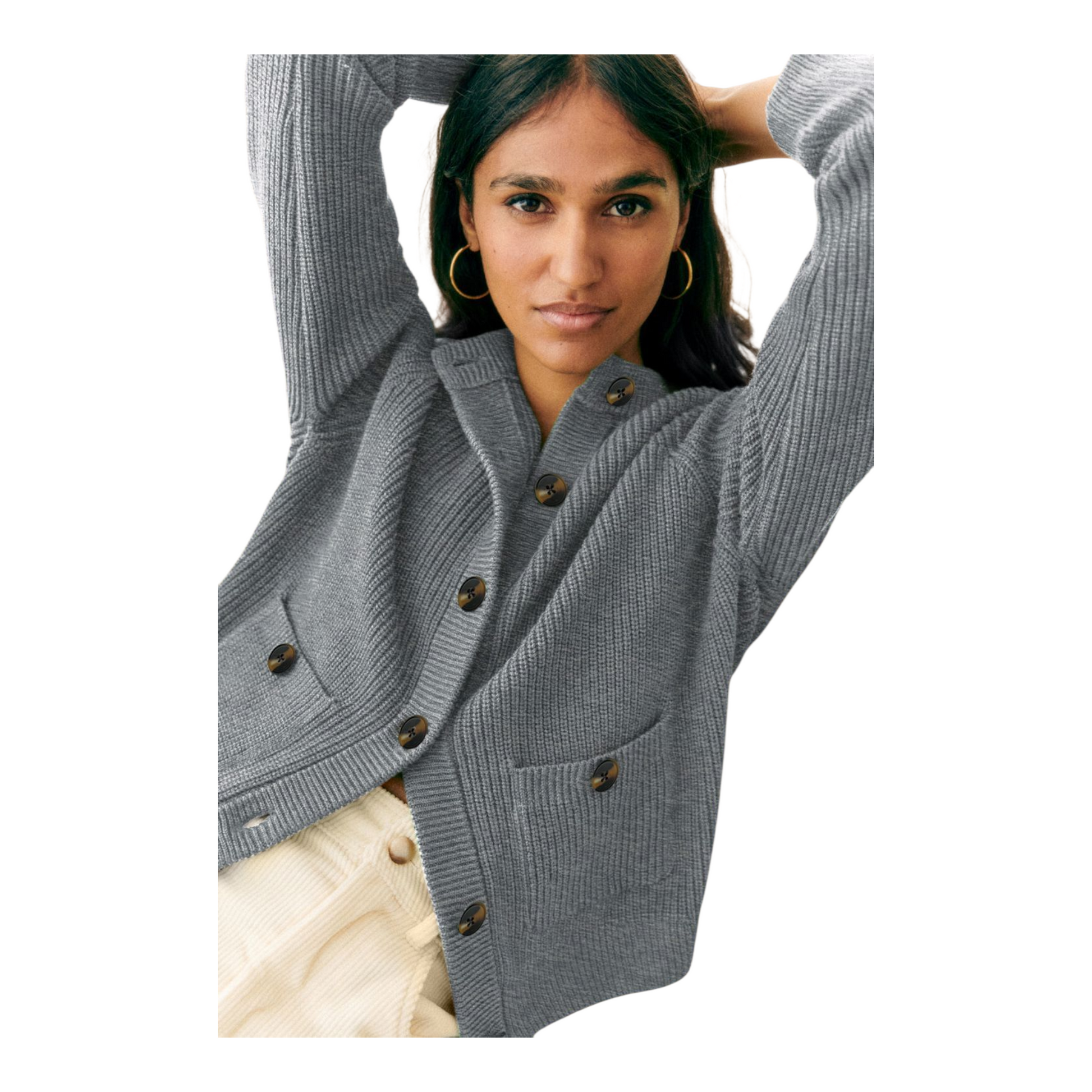 Woman wearing a gray cardigan with brown buttons on a white background