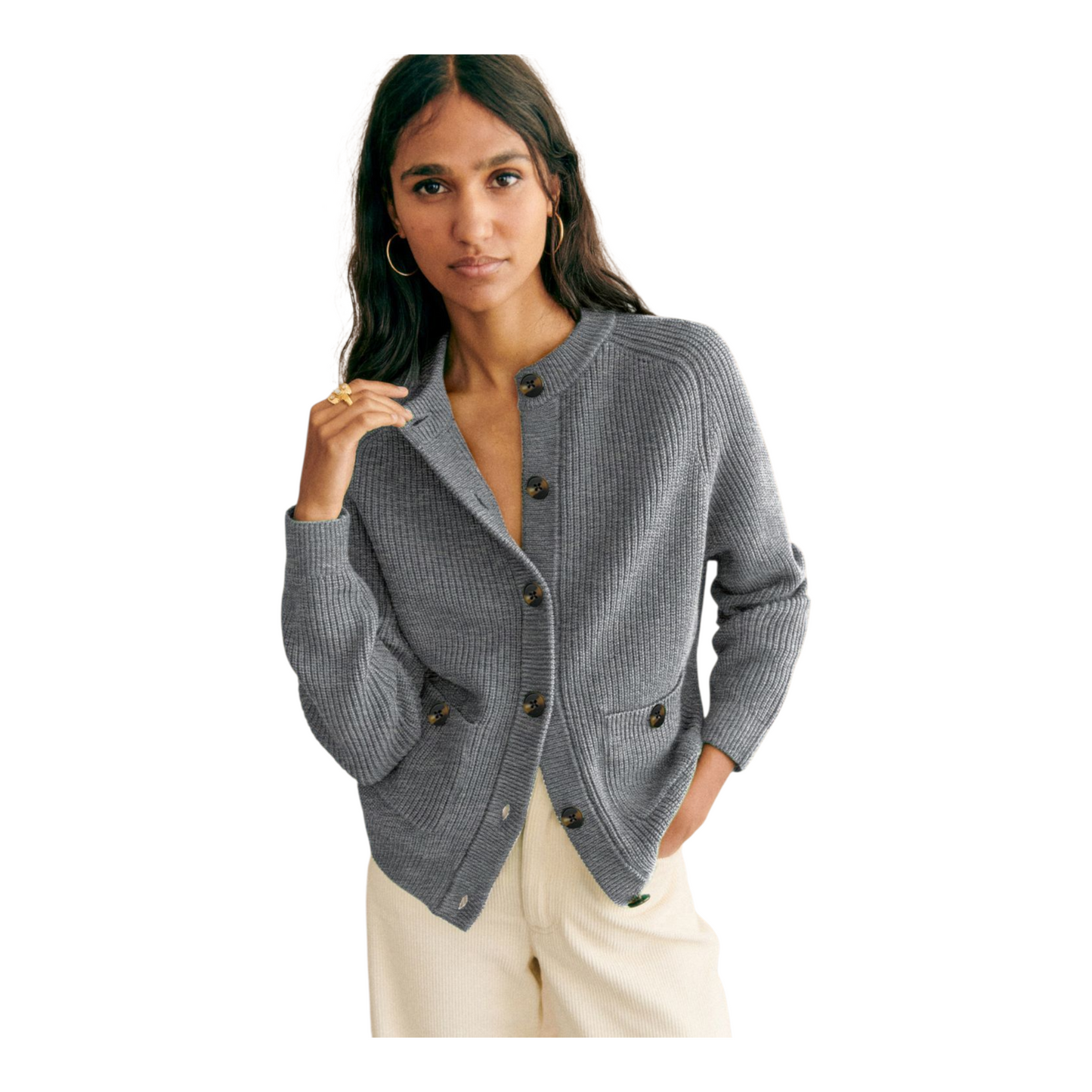 Woman wearing a gray cardigan on a white background