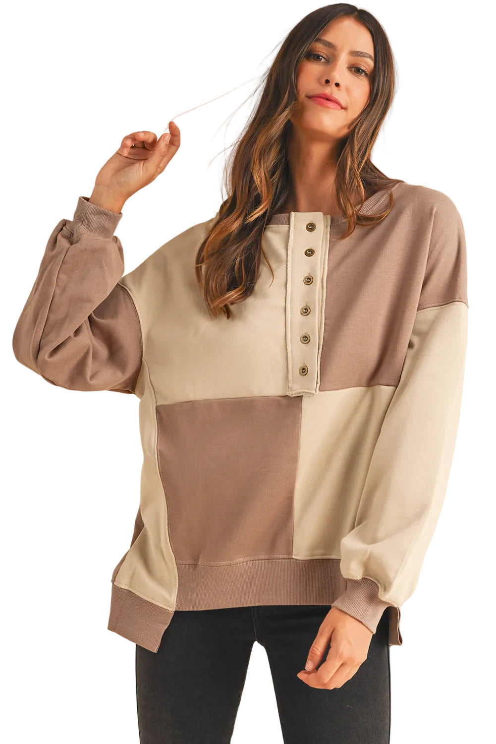 Woman wearing a two-tone blouse with a beige and brown design on a white background
