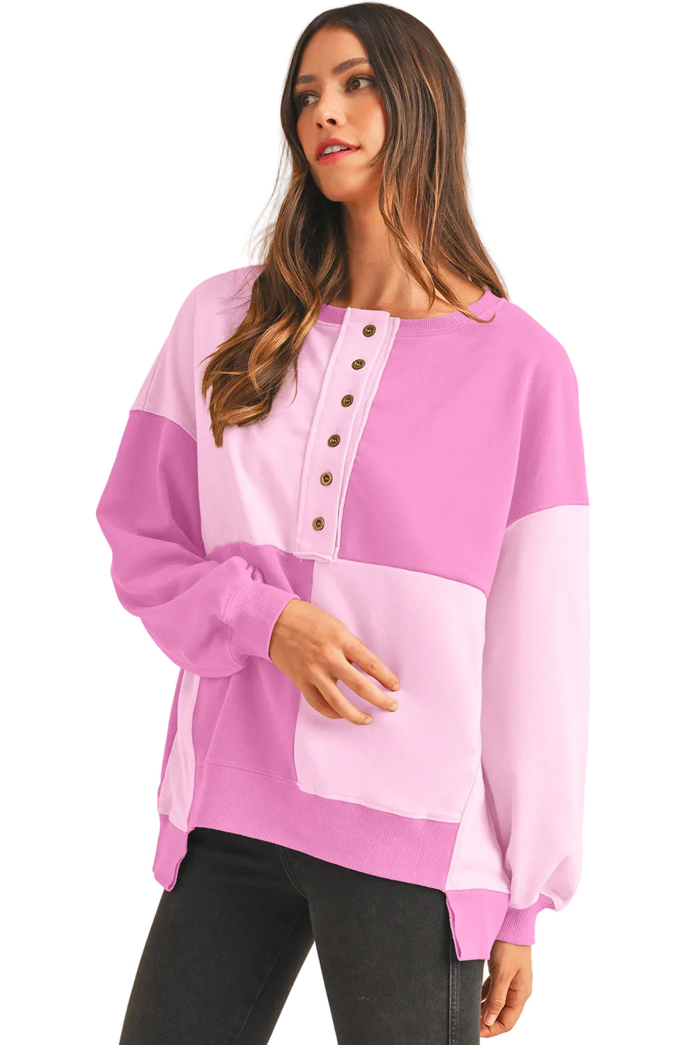 Woman wearing a pink and white long-sleeve top on a white background