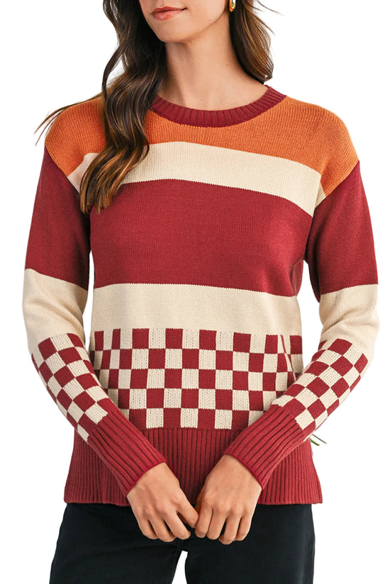 Color-blocked sweater with a checkered pattern on a plain background