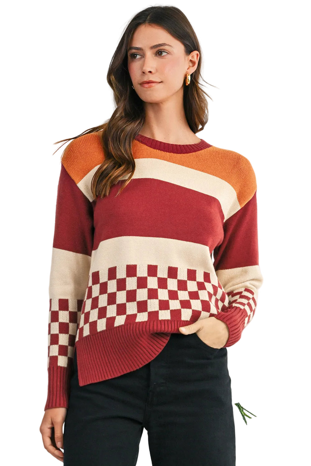 Woman wearing a colorful sweater with a checkered pattern on a white background