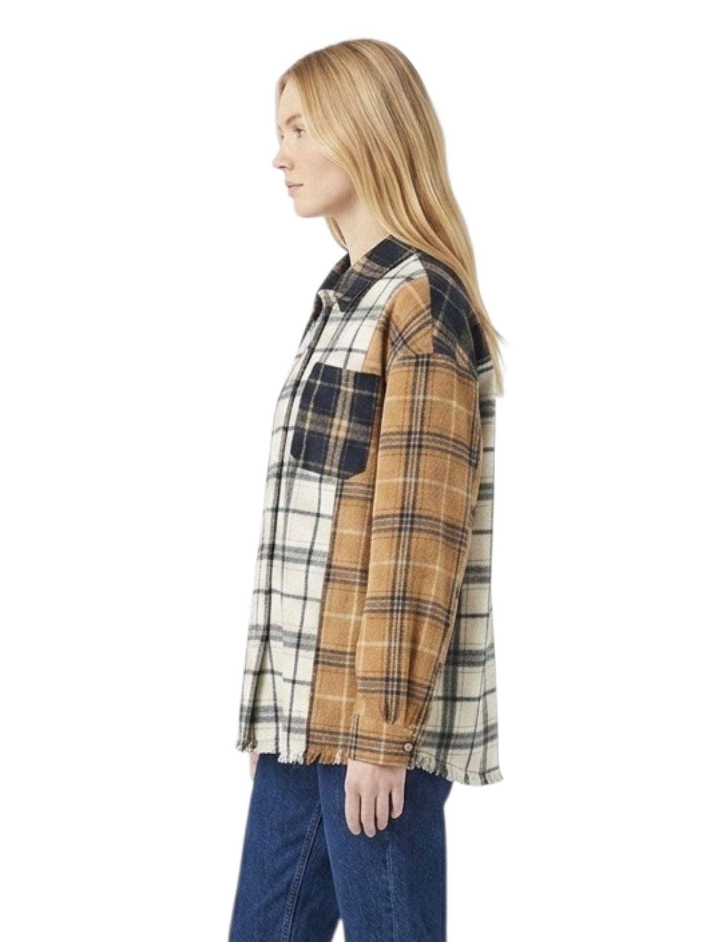 A woman shown in side profile wearing a patchwork plaid button-up shirt with blue jeans, photographed against a plain white background.