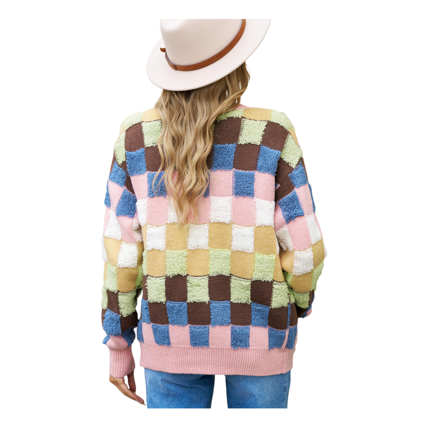 The back view of a textured grid pattern knit cardigan in a vibrant pink and earth-tone colourblock design with ribbed hem and cuffs.