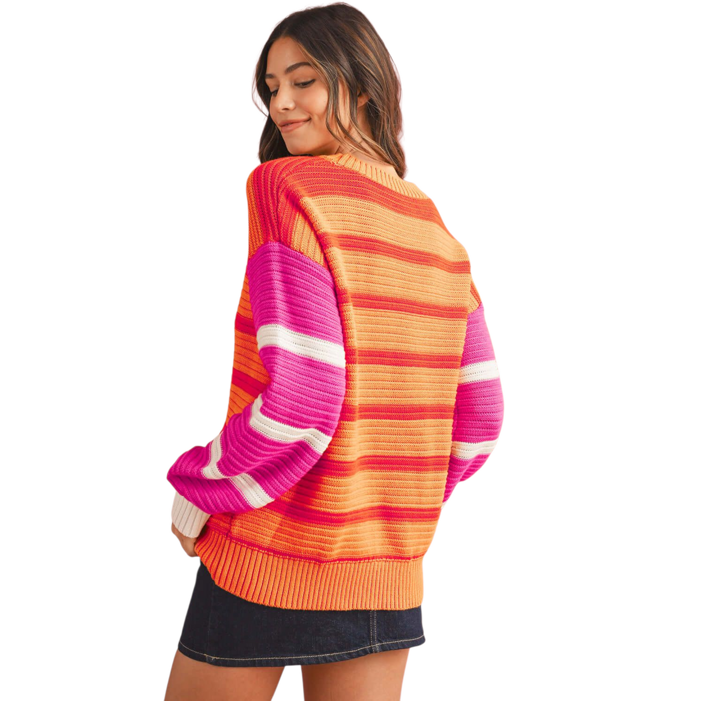 Woman wearing a colorful striped sweater on a white background