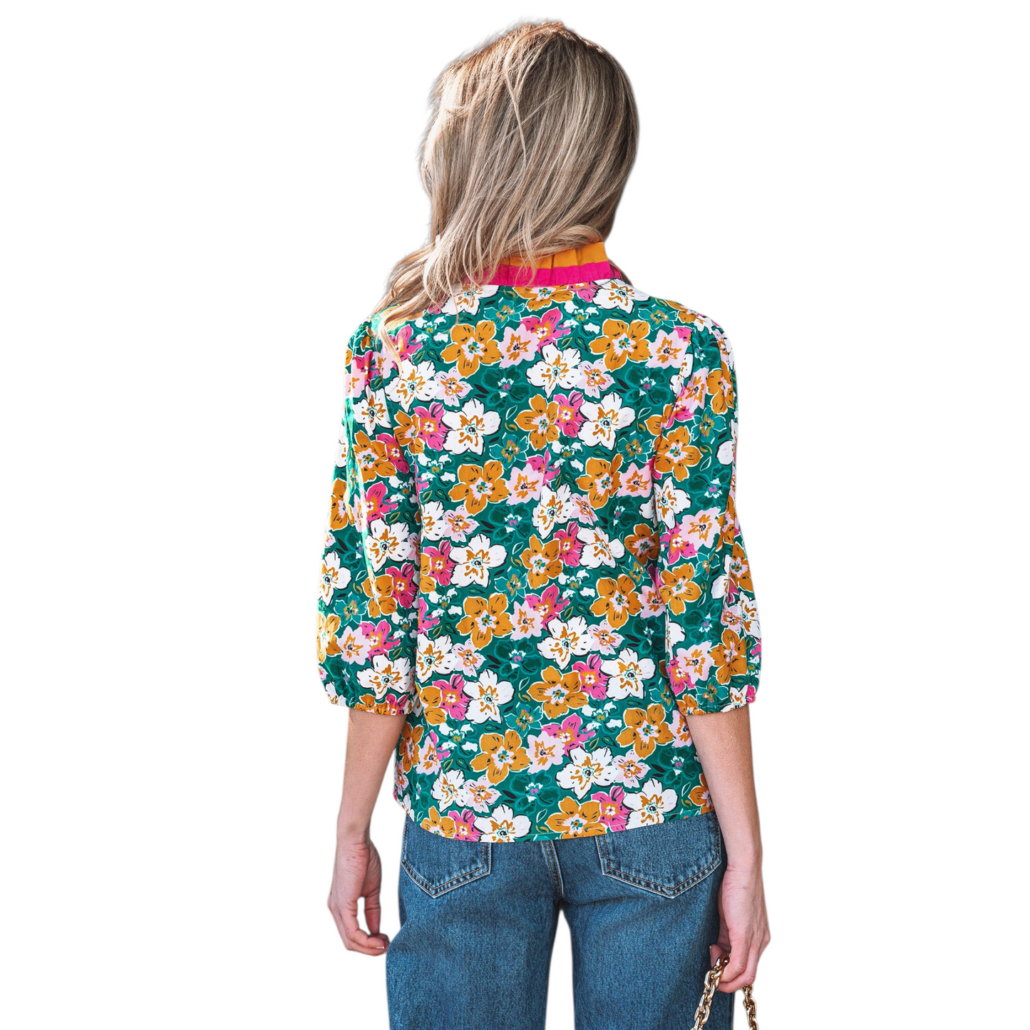 The rear view of a floral print blouse showcasing the 3/4 sleeves with elasticated cuffs and a comfortable, relaxed fit through the shoulders.