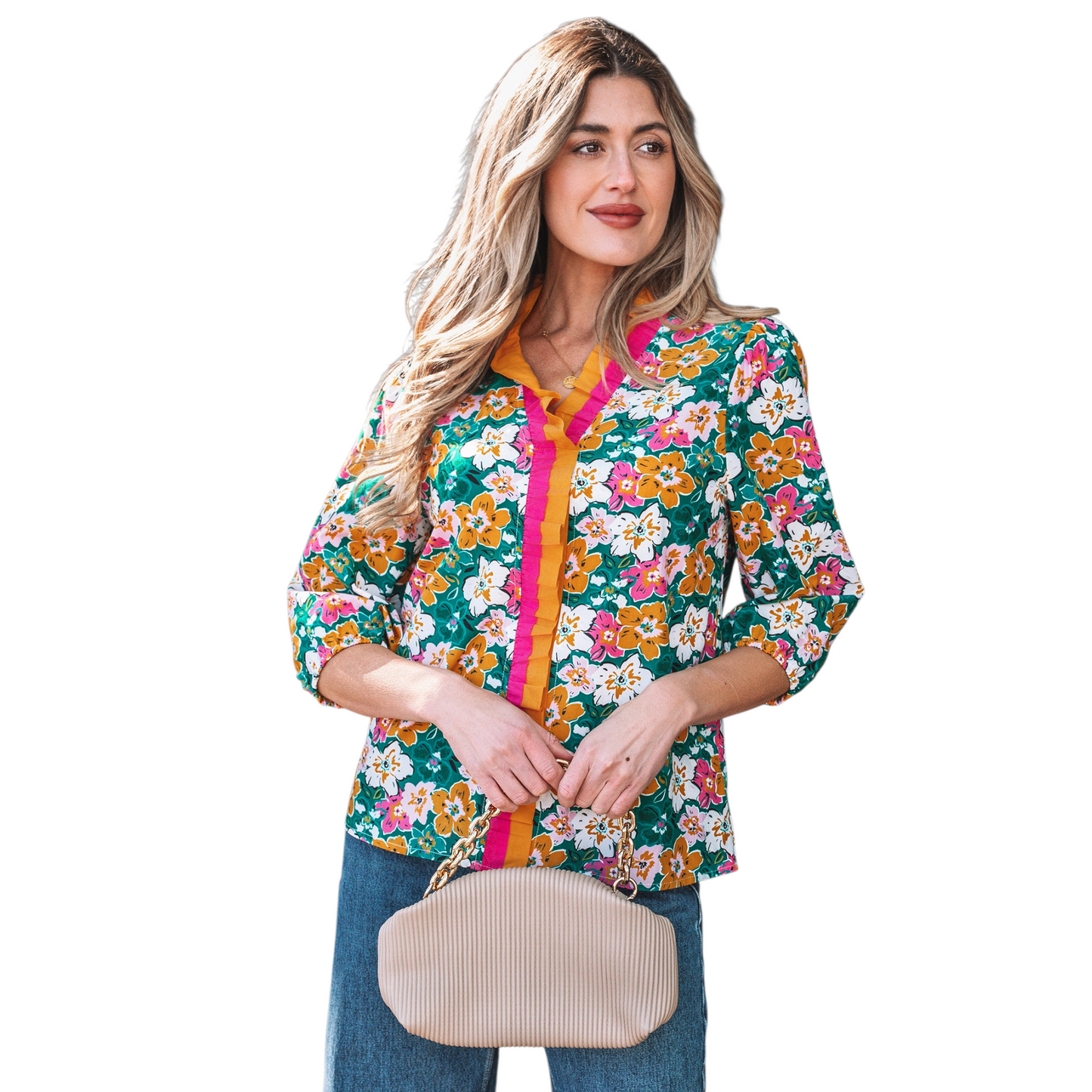 A woman wearing an emerald green floral V-neck blouse featuring distinctive magenta and ochre contrast frilled trim along the neckline and 3/4 length sleeves.