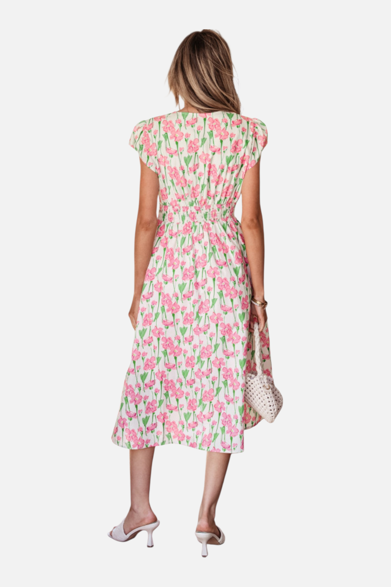 Woman wearing a floral dress on a white background
