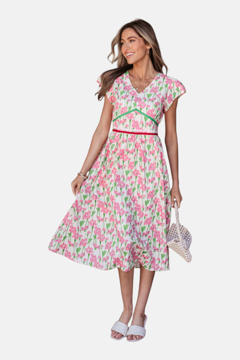 Woman wearing a floral dress on a white background