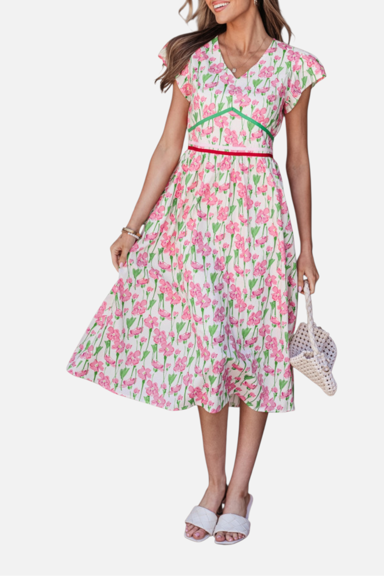 Woman wearing a pink floral dress on a white background