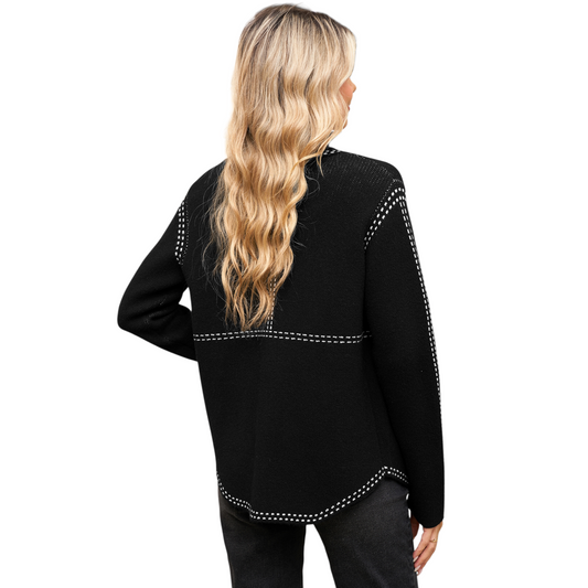 Black long-sleeve top with decorative trim on a white background