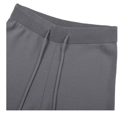 Gray sweatpants with drawstrings on a white background