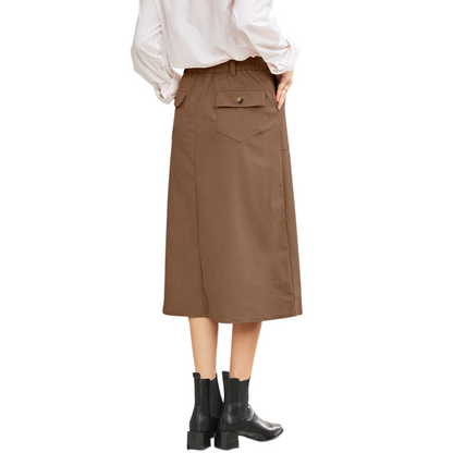 Brown skirt worn by a person on a white background