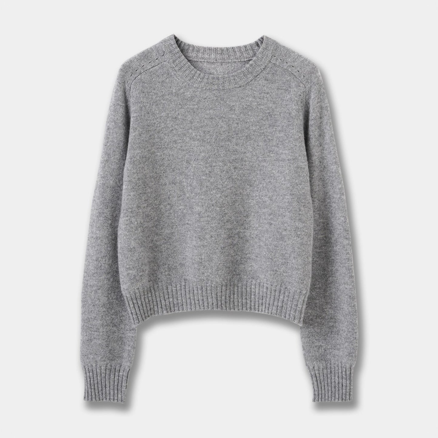 Front flat lay view of a grey marle crew neck wool-blend sweater on a solid grey background.