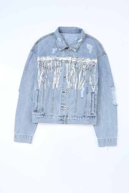 Light blue denim jacket with white sequin panel on a light blue background